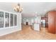 Open concept kitchen with stone countertops and stainless appliances overlooking the Gathering room at 567 E Tropical Dr, Casa Grande, AZ 85122