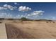 Expansive desert landscape with native shrubs and distant mountain views under a blue sky at 567 E Tropical Dr, Casa Grande, AZ 85122