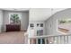 Bright loft space overlooking a pool table, featuring high ceilings, abundant natural light, and neutral decor at 567 E Tropical Dr, Casa Grande, AZ 85122