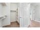 Well-organized walk-in closet with built-in shelving and hanging space located next to the bathroom at 567 E Tropical Dr, Casa Grande, AZ 85122