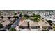 Aerial view of community featuring a pool, green spaces, and single-Gathering homes at 5815 E Nora St, Mesa, AZ 85215