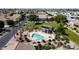 Aerial view of the community pool, spa, ramada, and green common spaces at 5815 E Nora St, Mesa, AZ 85215
