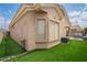 Attractive backyard includes artificial turf, view fencing, and an easy-care landscape at 5815 E Nora St, Mesa, AZ 85215