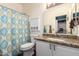 Bathroom featuring granite countertop, vanity with sink, mirror, and shower with curtain at 5815 E Nora St, Mesa, AZ 85215