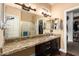 Bathroom featuring granite counters, a large mirror, and a walk-in closet and stand-up shower at 5815 E Nora St, Mesa, AZ 85215