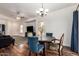 Elegant dining area with stylish furnishings, hardwood floors, and an open layout at 5815 E Nora St, Mesa, AZ 85215