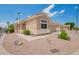 Charming single-story home featuring a tile roof, neutral stucco exterior, and low-maintenance desert landscaping at 5815 E Nora St, Mesa, AZ 85215