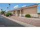 Charming front entrance with a decorative door, seating area, and desert landscaping at 5815 E Nora St, Mesa, AZ 85215
