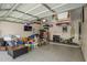 The garage includes an epoxy floor and overhead storage racks at 5815 E Nora St, Mesa, AZ 85215