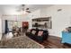 Open-concept living area with hardwood floors, vaulted ceilings, and seamless connection to the kitchen at 5815 E Nora St, Mesa, AZ 85215