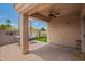Relax on the covered patio with brick pavers and views of the private backyard at 5815 E Nora St, Mesa, AZ 85215