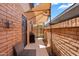 Cozy back patio featuring a grill, shaded seating, and a secured gate for privacy at 6416 S Kenneth Pl # D, Tempe, AZ 85283