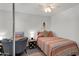 Cozy bedroom featuring a single bed, desk, and stylish decor with a modern ceiling fan at 6416 S Kenneth Pl # D, Tempe, AZ 85283
