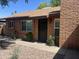 A well-kept brick home with secure front entrance and desert landscaping at 6416 S Kenneth Pl # D, Tempe, AZ 85283