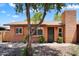 Charming single-story brick home with a well-maintained front yard and a mature tree at 6416 S Kenneth Pl # D, Tempe, AZ 85283