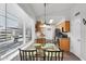 Sunlit eat-in kitchen boasts modern appliances and a view to the front yard at 6416 S Kenneth Pl # D, Tempe, AZ 85283