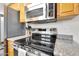 Well-equipped kitchen features stainless steel appliances and ample counter space at 6416 S Kenneth Pl # D, Tempe, AZ 85283