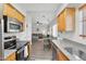 An open floor plan connecting the kitchen to the living and dining areas at 6416 S Kenneth Pl # D, Tempe, AZ 85283