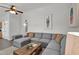 Cozy living room with a large gray sectional sofa and wooden coffee table at 6416 S Kenneth Pl # D, Tempe, AZ 85283