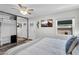 Main bedroom featuring built-in wardrobe, tv and ample light at 6416 S Kenneth Pl # D, Tempe, AZ 85283
