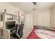 Bedroom with a desk, closet and decorative niche with an adjacent door to a connected room at 6516 E Rochelle St, Mesa, AZ 85215