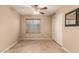 Sunny bedroom with a large window and closet offers lots of natural light at 6516 E Rochelle St, Mesa, AZ 85215
