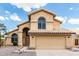 Charming two-story home featuring a double garage, tile roof, and a neutral color scheme for a welcoming curb appeal at 6516 E Rochelle St, Mesa, AZ 85215