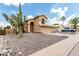 Beautiful home featuring desert landscaping, including a mature Saguaro cactus, for a classic Southwest style at 6516 E Rochelle St, Mesa, AZ 85215