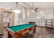 Large game room with a pool table, recessed lighting, and vaulted ceilings, seamlessly connecting with the kitchen at 6516 E Rochelle St, Mesa, AZ 85215