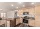 Well-equipped kitchen featuring stainless steel appliances, wood floors and ample storage at 6516 E Rochelle St, Mesa, AZ 85215