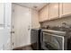 Convenient laundry room with modern washer and dryer; spacious and well-lit at 6516 E Rochelle St, Mesa, AZ 85215