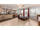 Open concept living space with backyard views, tile floors, and easy kitchen access at 6516 E Rochelle St, Mesa, AZ 85215