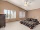 Bedroom features vaulted ceiling, carpet floors, dresser, and large windows at 6516 E Rochelle St, Mesa, AZ 85215