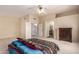 Large bedroom with neutral walls, carpet, and en suite bathroom access at 6516 E Rochelle St, Mesa, AZ 85215