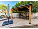 Outdoor dining space with shaded gazebo perfect for entertaining at 7029 E Monte Cir, Mesa, AZ 85209