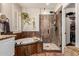 A well-appointed bathroom showcases a soaking tub and walk-in shower with decorative tile and granite countertops at 7029 E Monte Cir, Mesa, AZ 85209
