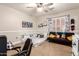 This room includes a black futon, playful decor, and a comfortable gaming chair at 7029 E Monte Cir, Mesa, AZ 85209