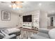 Cozy bonus room featuring built-in shelving, comfortable seating, and a stylish geometric rug at 7029 E Monte Cir, Mesa, AZ 85209