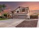 Beautiful two-story home showcasing a three-car garage and nice landscaping at 7029 E Monte Cir, Mesa, AZ 85209