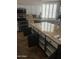 Bright kitchen showcasing granite countertops, white cabinets, stainless steel appliances, and convenient pull-out drawers at 7029 E Monte Cir, Mesa, AZ 85209