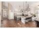 Bright, open kitchen with vaulted ceilings, stainless steel appliances, and a large center island with bar seating at 7029 E Monte Cir, Mesa, AZ 85209