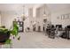 Open-concept living room with high ceilings, neutral walls, and decorative lighting at 7029 E Monte Cir, Mesa, AZ 85209