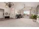 Open-concept living room with high ceilings, carpet flooring, and lots of light at 7029 E Monte Cir, Mesa, AZ 85209