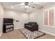 The living room offers a comfortable gray sofa, and geometric rug with a television for relaxing at 7029 E Monte Cir, Mesa, AZ 85209