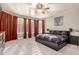 Serene main bedroom with a large window, plush carpeting, and contemporary decor at 7029 E Monte Cir, Mesa, AZ 85209
