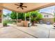 Covered patio area with an outdoor kitchen, built-in grill, and ample space for entertaining at 7029 E Monte Cir, Mesa, AZ 85209