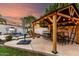 This backyard includes a covered patio, dining seating, and a pool area, perfect for outdoor entertainment at 7029 E Monte Cir, Mesa, AZ 85209