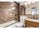 Bathroom featuring tiled shower with a vanity at 7047 W Almeria Rd, Phoenix, AZ 85035
