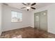 Cozy bedroom with natural light and a closet at 7047 W Almeria Rd, Phoenix, AZ 85035