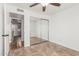 Bedroom with a closet and tile flooring at 7047 W Almeria Rd, Phoenix, AZ 85035